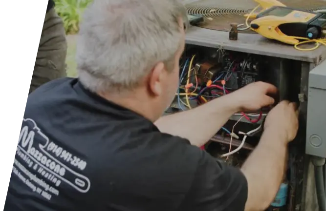 Technician Wiring Air Conditioner